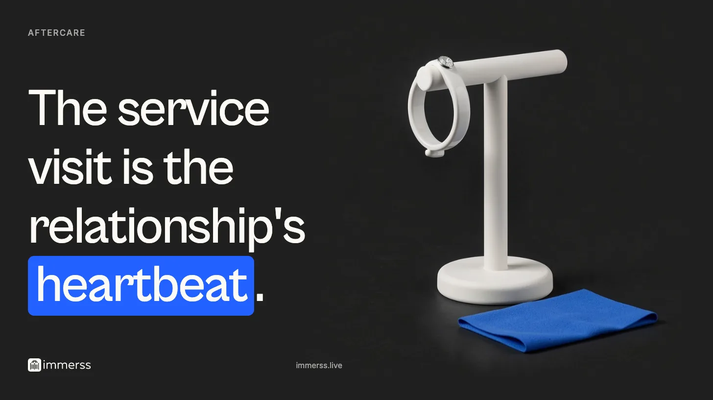 The service visit is the relationship's heartbeat. A cuff bracelet hanging on a T-bar jewelry stand with a folded polishing cloth laid at its base