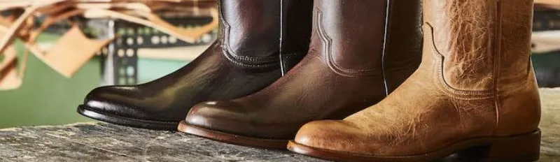 Lucchese boots on a workbench.