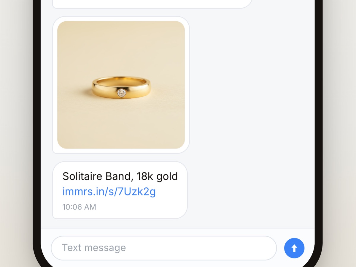The advisor's next text arrives as a photograph of the ring and, under it, the piece's name with a short link straight to it.